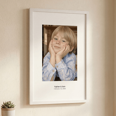 Premium white wooden picture frame showcasing a personalized child photo print with text.