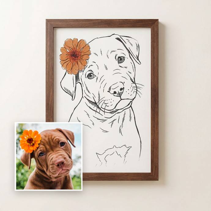 A framed custom pet portrait print featuring a black line art sketch of a puppy with an orange flower accent, shown next to a small reference photo of a brown puppy on a light beige wall. - Image 1