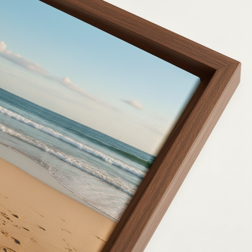Close-up of a wooden framed canvas corner with a beach print.